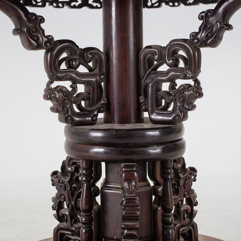 A Chinese wooden table, early 20th century.