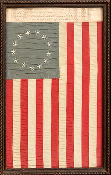 An 13 star American national flag made by Granddaughter of Betsy Ross, Rachel Albright in Feb 1903.