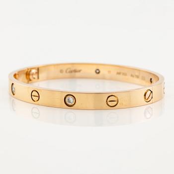 A Cartier "Love" bracelet in 18K rose gold with round brilliant-cut diamonds.