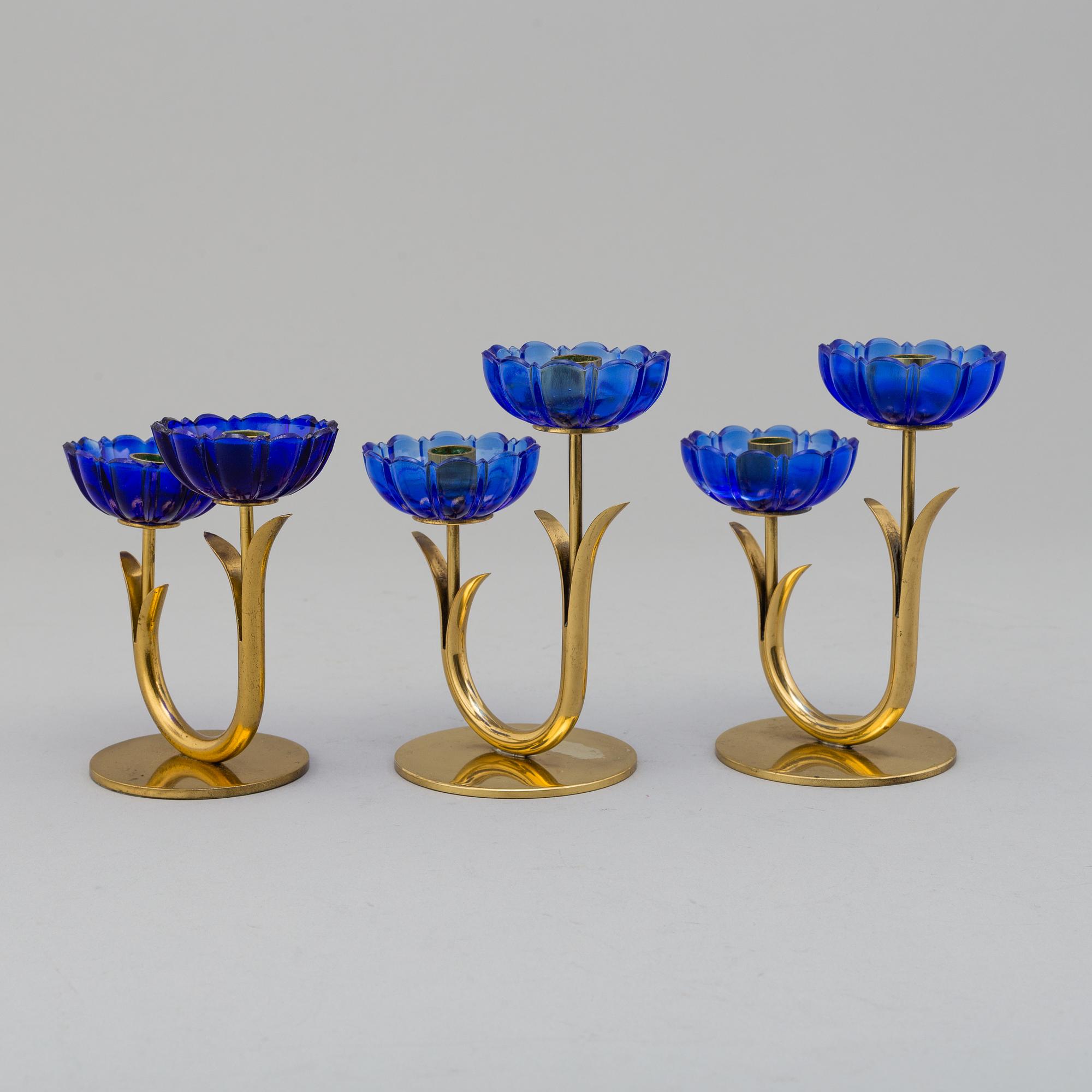 GUNNAR ANDER, 8 brass candlesticks. Ystad Metall, mid 20th century.