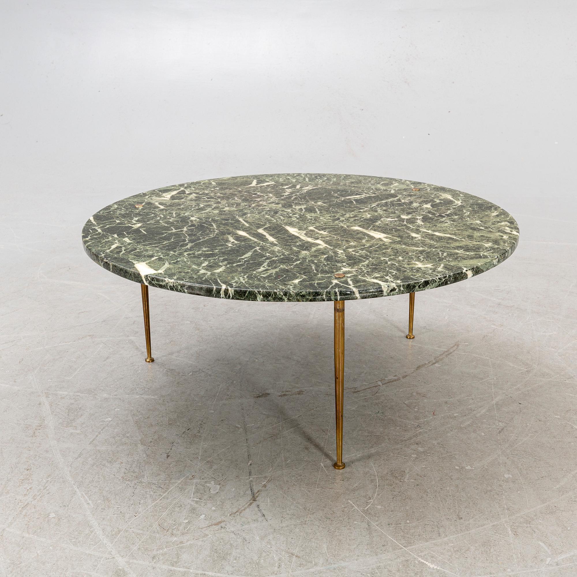 A marble coffee table alter part of the 20th century.