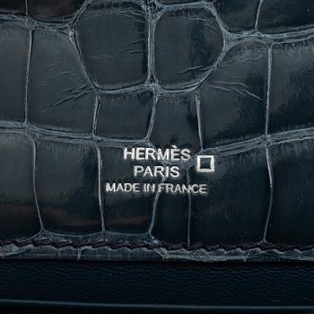 Hermès, A 'Kelly Pochette' in Shiny Alligator Mississippiensis Palladium Hardware, 2016.