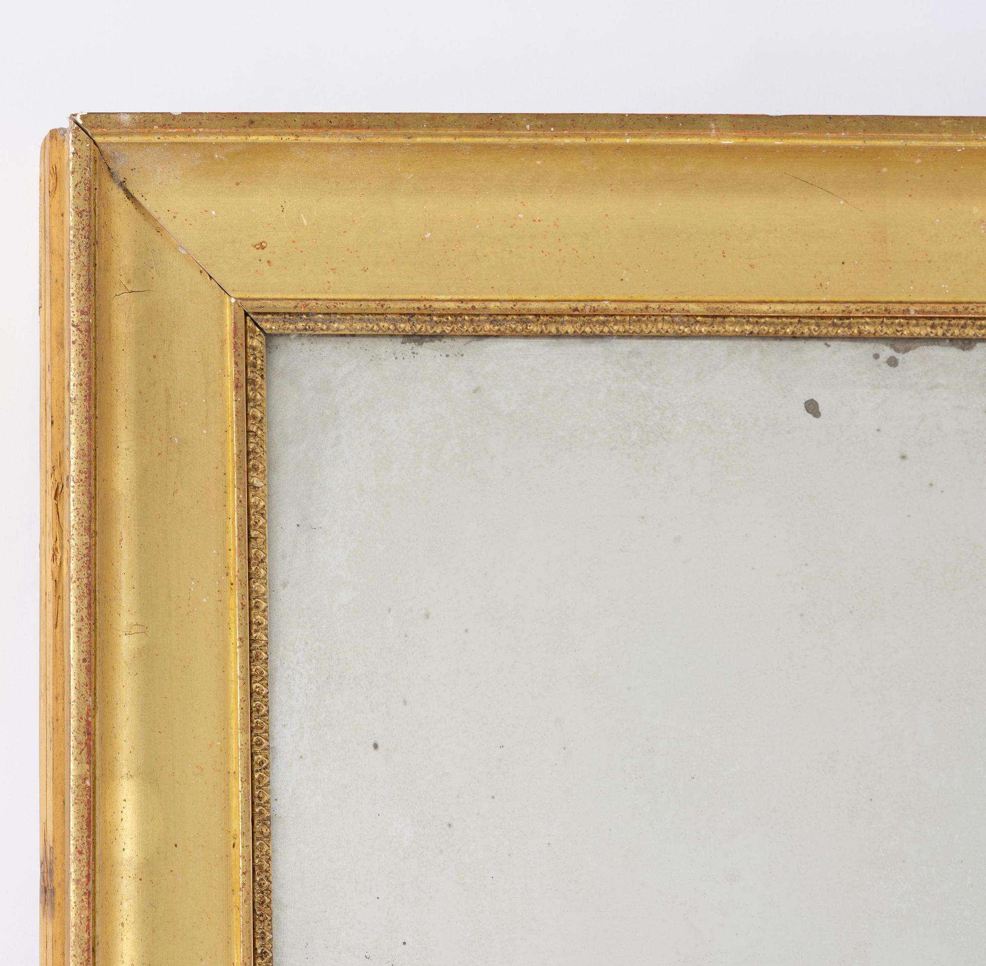 A Swedish giltwood Empire mirror, first part 19th century.