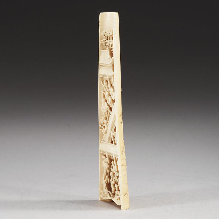 A carved ivory armrest, Qing dynasty.