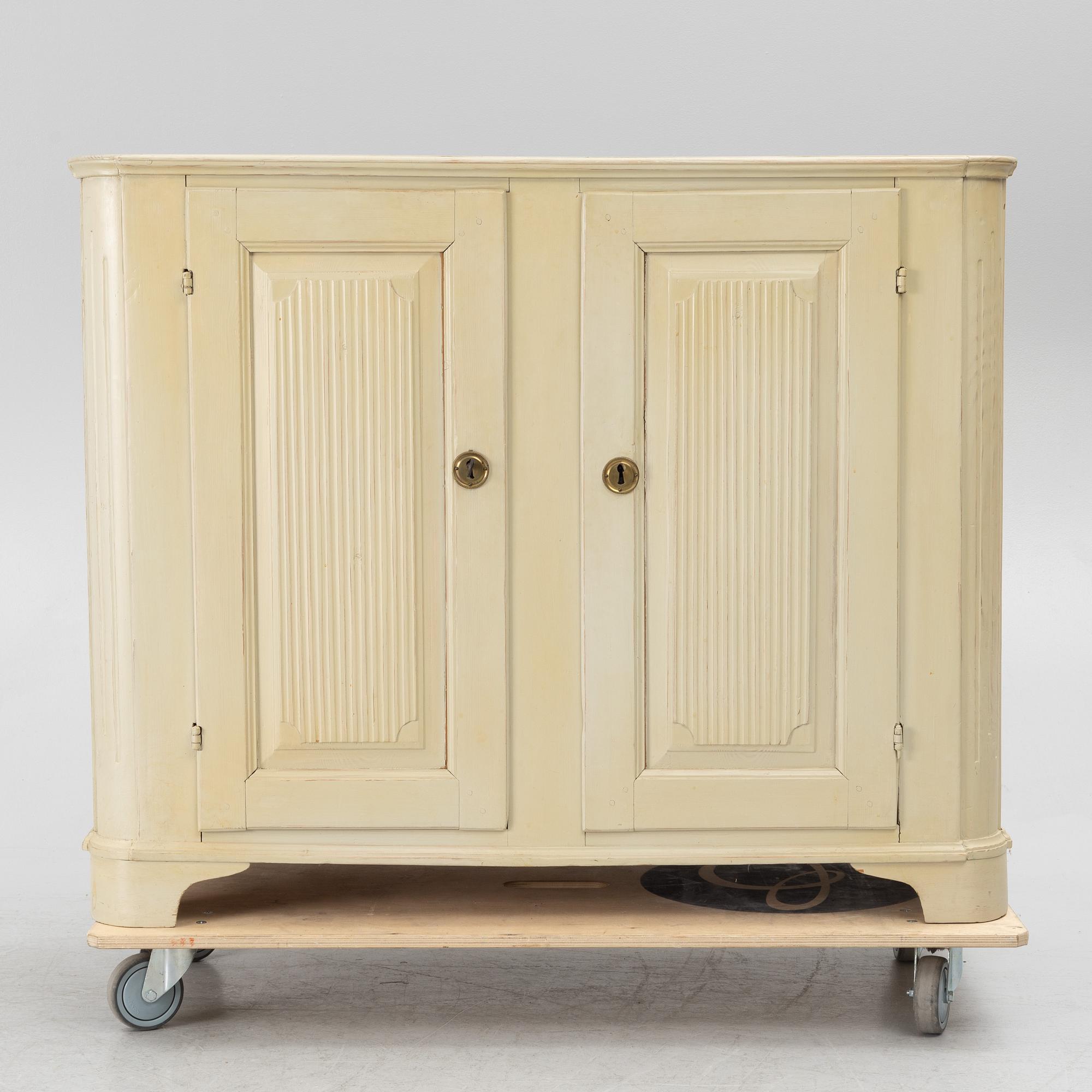 A Gustavian cupboard, early 19th century.