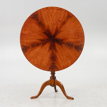 A folding table, early 20th century.