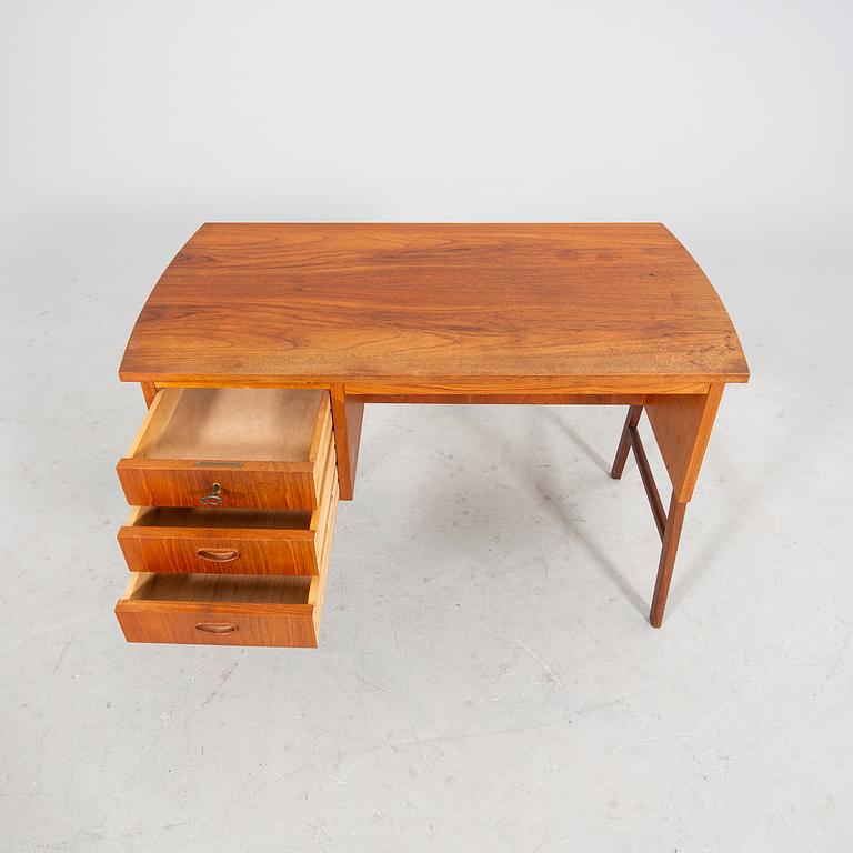 A veneered desk from the mid 1900's.