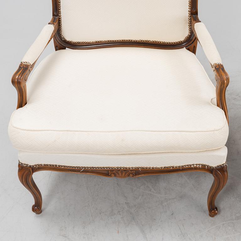 A pair of Rococo style armchairs, later part of the 20th century.