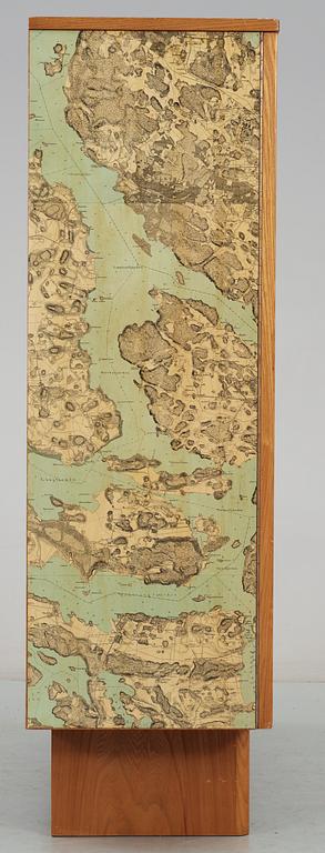 A G.A. Berg cabinet with printed map depicting the city of Stockholm, Sweden 1940's.