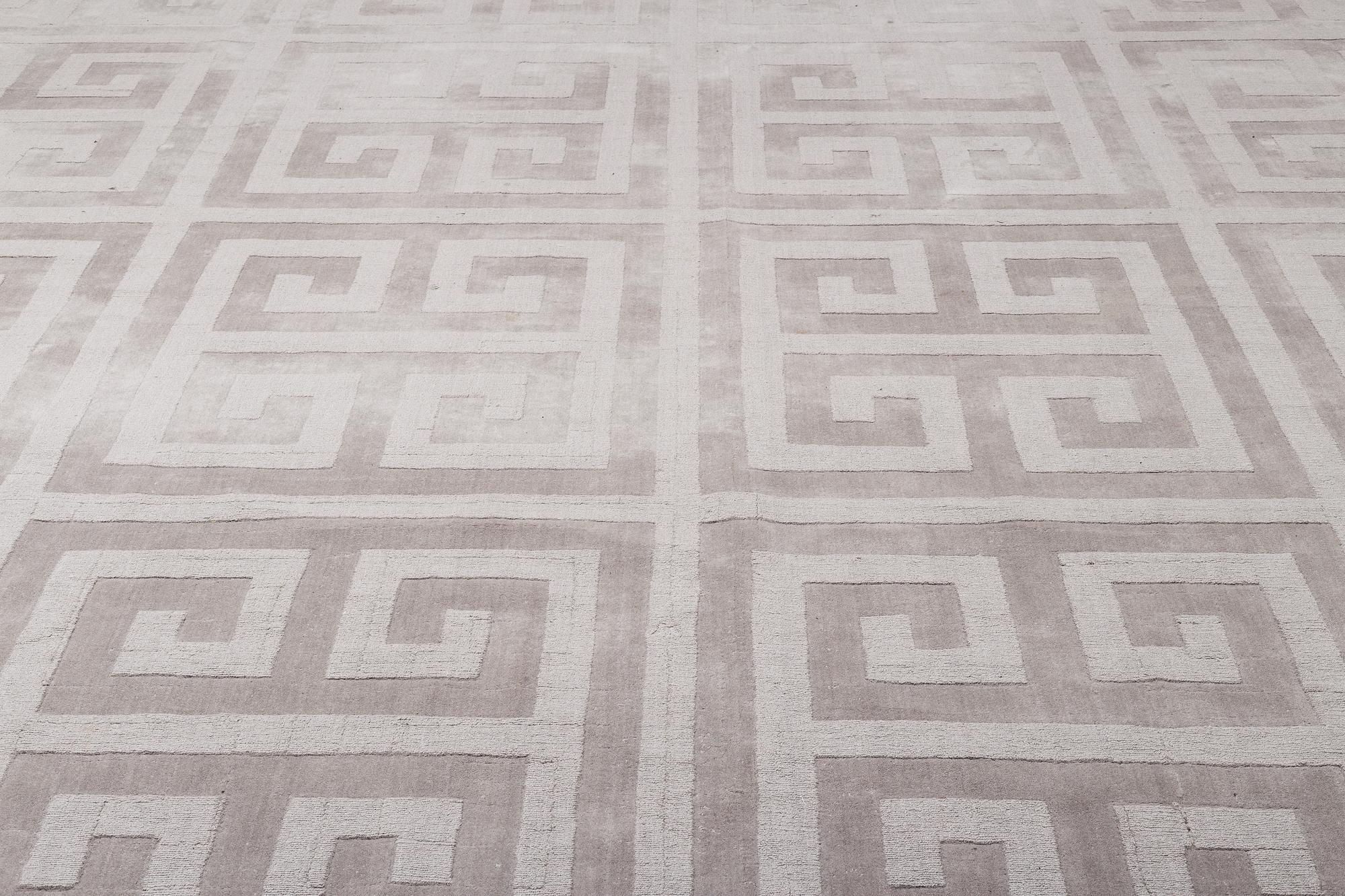 A Layered "Wool Cubes" carpet, 390x620 cm.