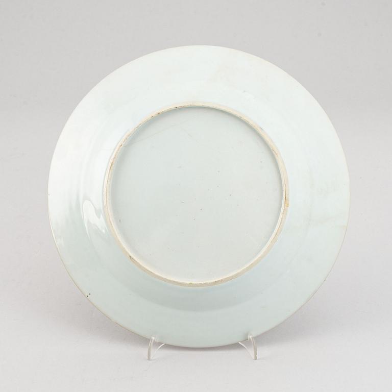 A set of two blue and white serving dishes, and two famille rose dinner plates, Qing dynasty, Qianlong (1736-95).