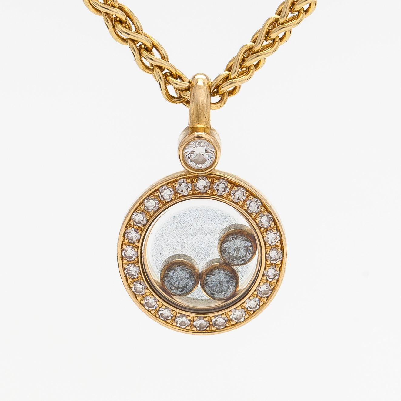 Chopard, an 18K gold 'Happy Diamonds' necklace with brilliant-cut diamonds.