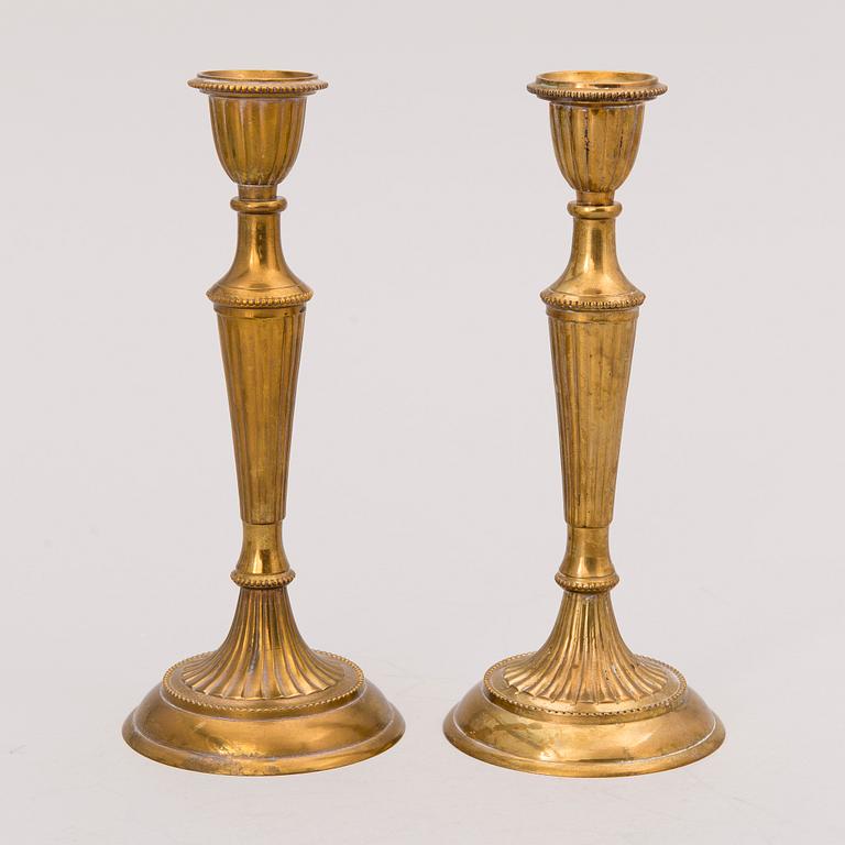 Set of ten 19th/20th Century brass and wood candlesticks.