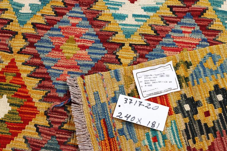 A Kilim rug, c. 240 x 181 cm.