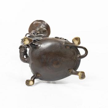 A bronze candle holder, Japan, 20th century.