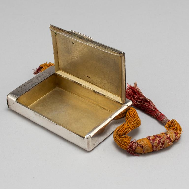 A Russian late 19th century parcel-gilt silver cigarette-case, unidentified makers mark, St. Petersburg.