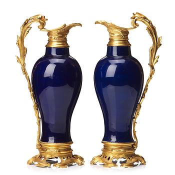 701. A pair of gilt bronze mounted vases, Qing dynasty, Qianlong (1736-95). French bronze mounts.