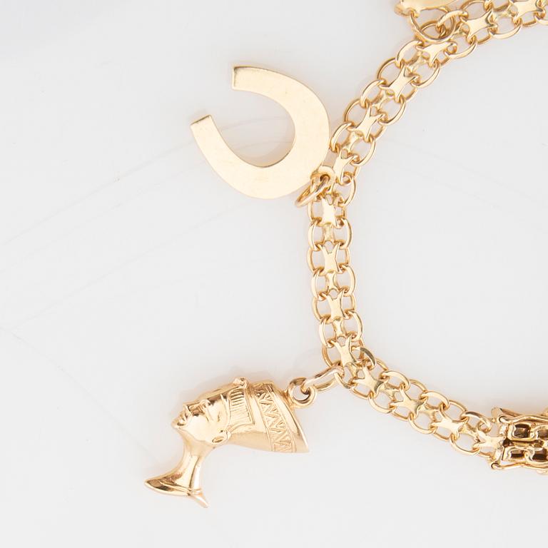 Bracelet 18K gold Bismarck link with charms.