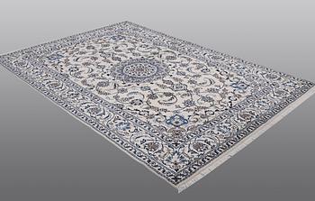 A carpet Nain, part silk, ca 290 x 196 cm.