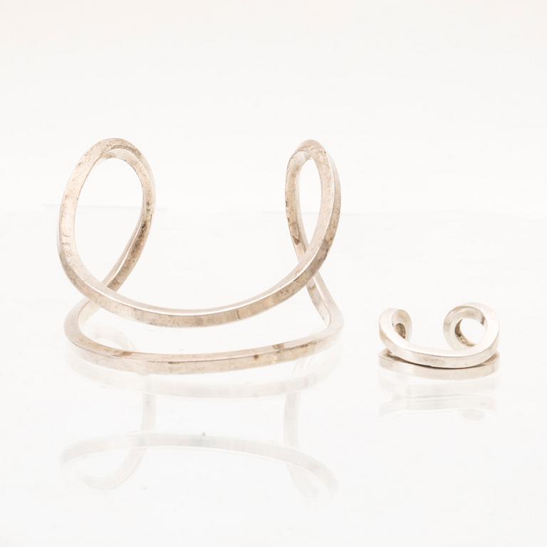 A silver ring and bracelet "loop cuff" by Efva Attling.