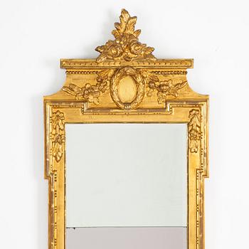 A Gustavian giltwood mirror by N. Meunier (master in Stockholm 1754-97, supplier to the royal court 1769).