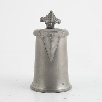 A pewter measuring cup by an unidentified master, dated 1766.