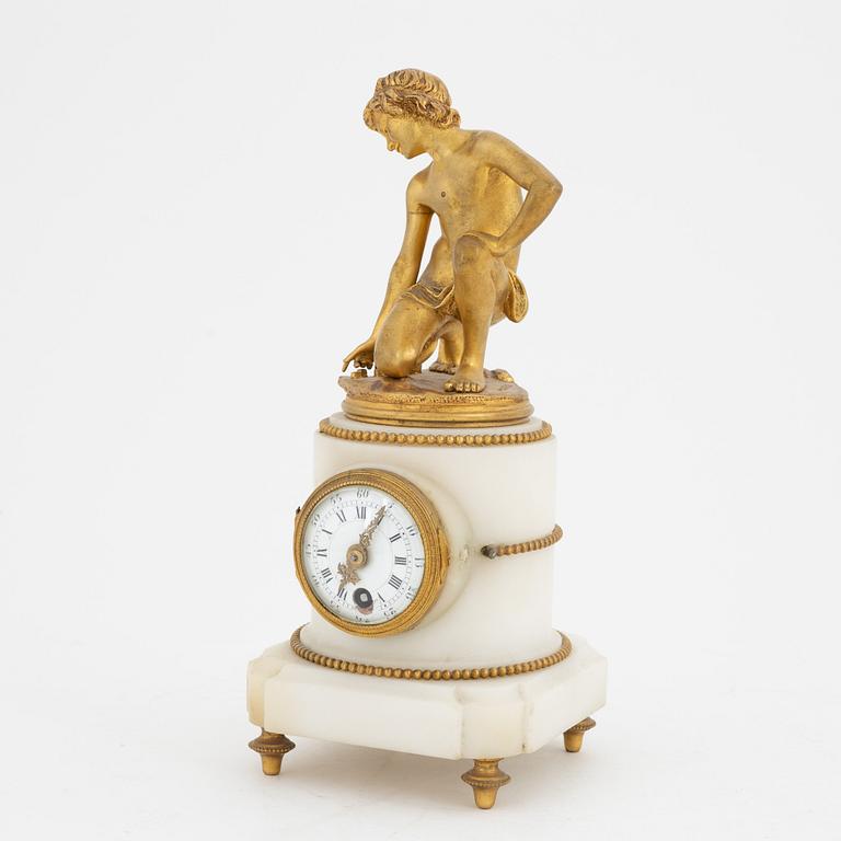 A Louis XVI-style marble and ormolu mantel clock, late 19th Century.