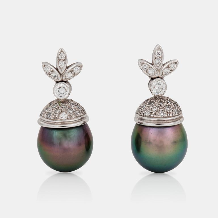 A pair of cultured Tahiti pearl and diamond earrings.