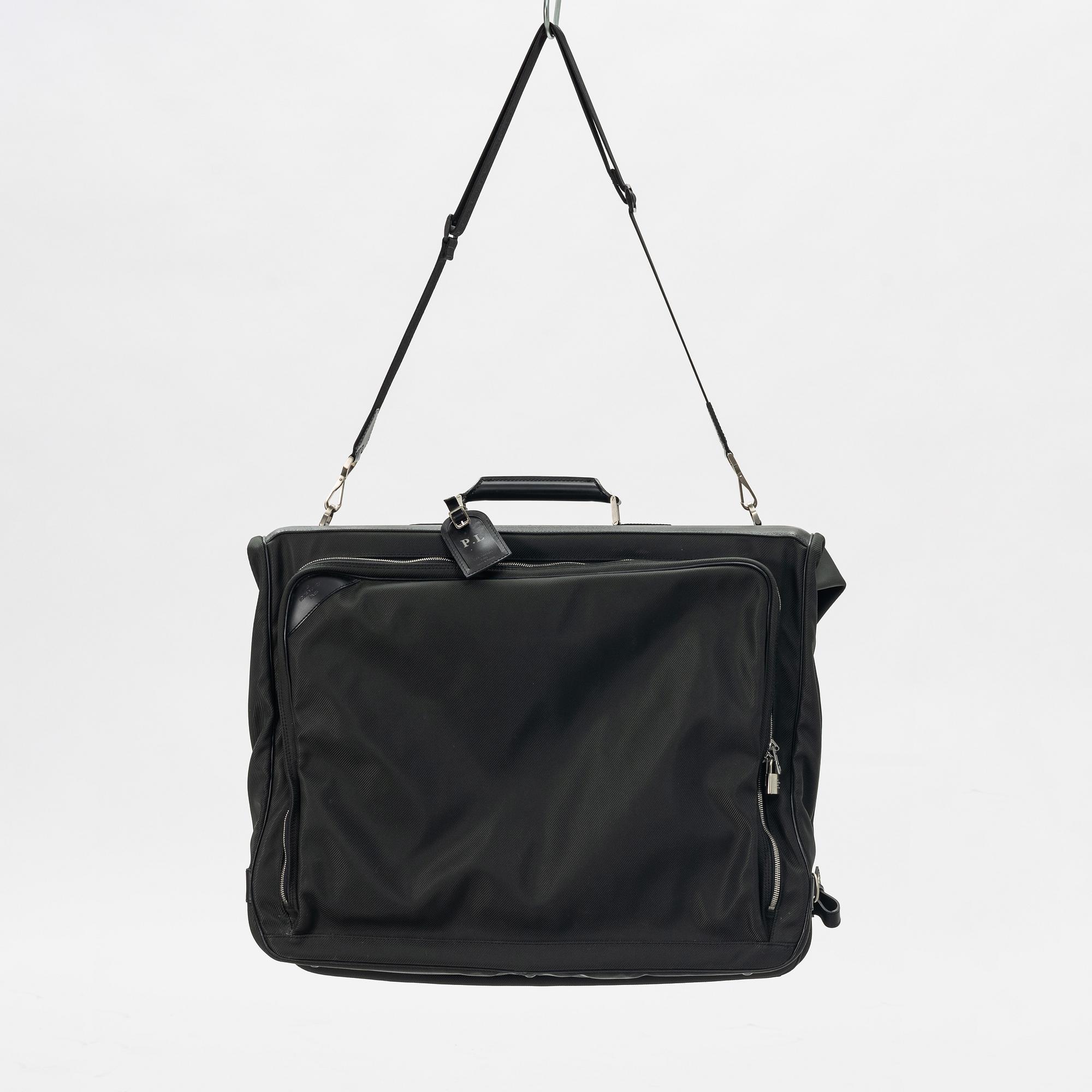 Louis Vuitton, a green canvas and Taiga garment bag.