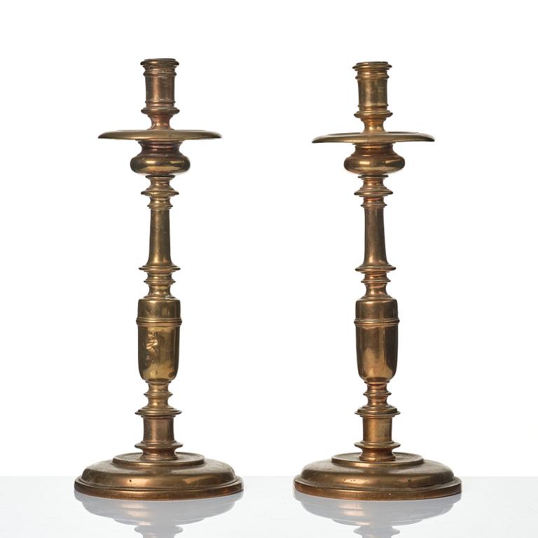 A pair of baroque brass candlesticks, 18th century.