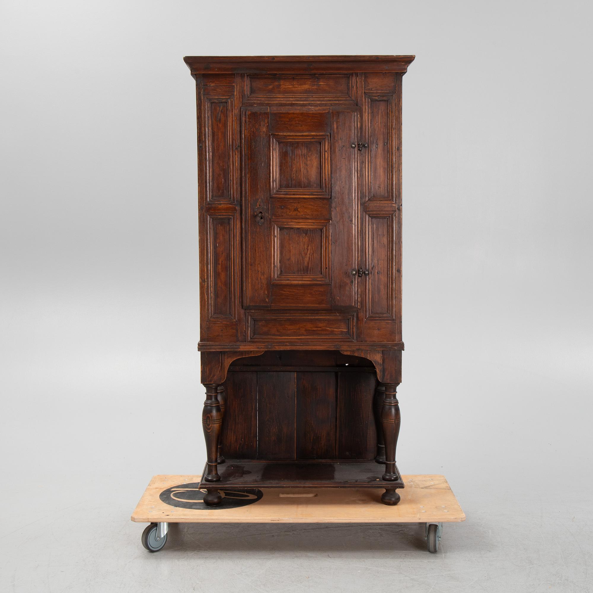A Baroque cabinet on a later stand, early 18th Century.
