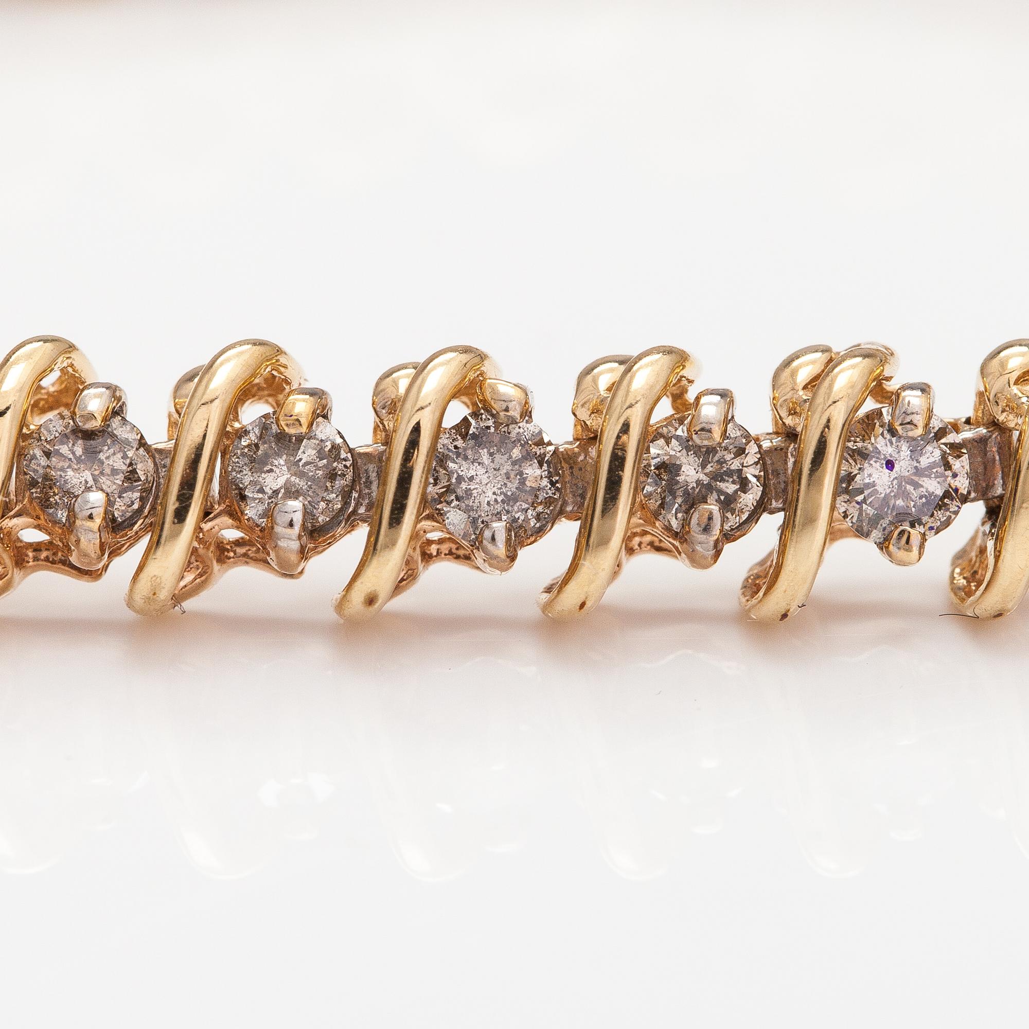 A 14K gold bracelet with light brown diamonds ca. 2.38 ct in total.