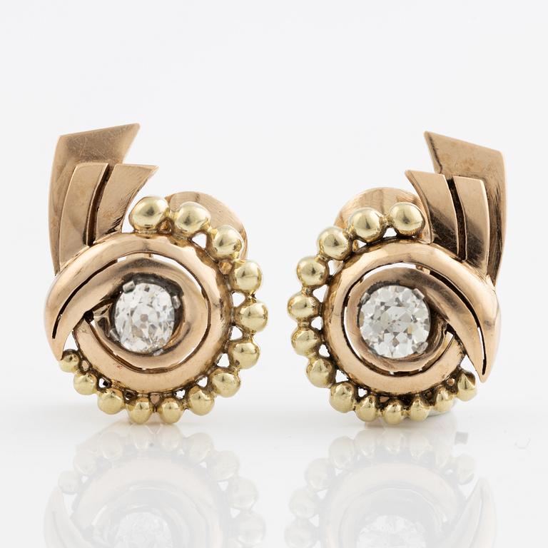 A pair of earrings in 14K gold set with old-cut diamonds.