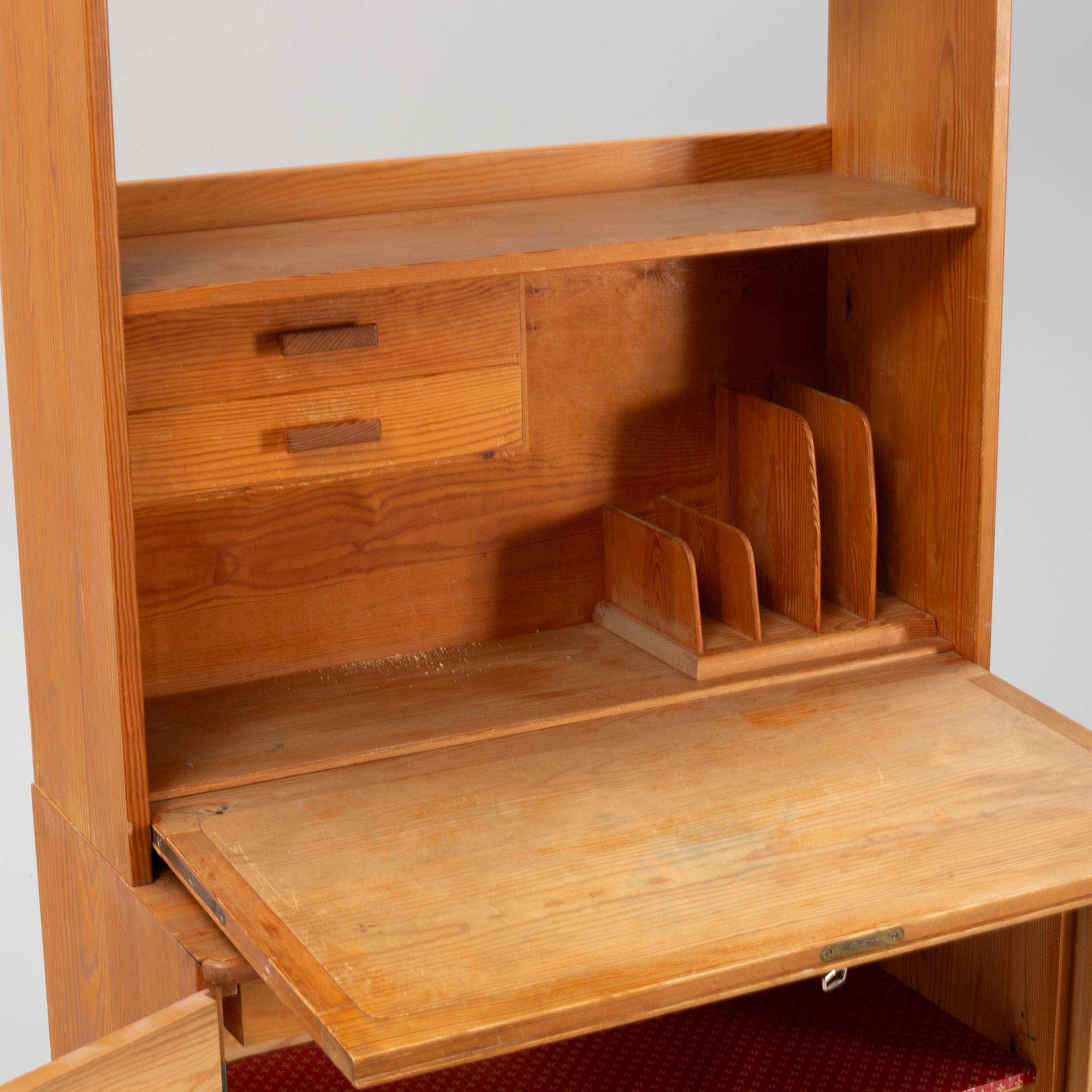 Göran Malmvall, a pinewood book case with secretaire and cabinet, second part of the 20th Century.