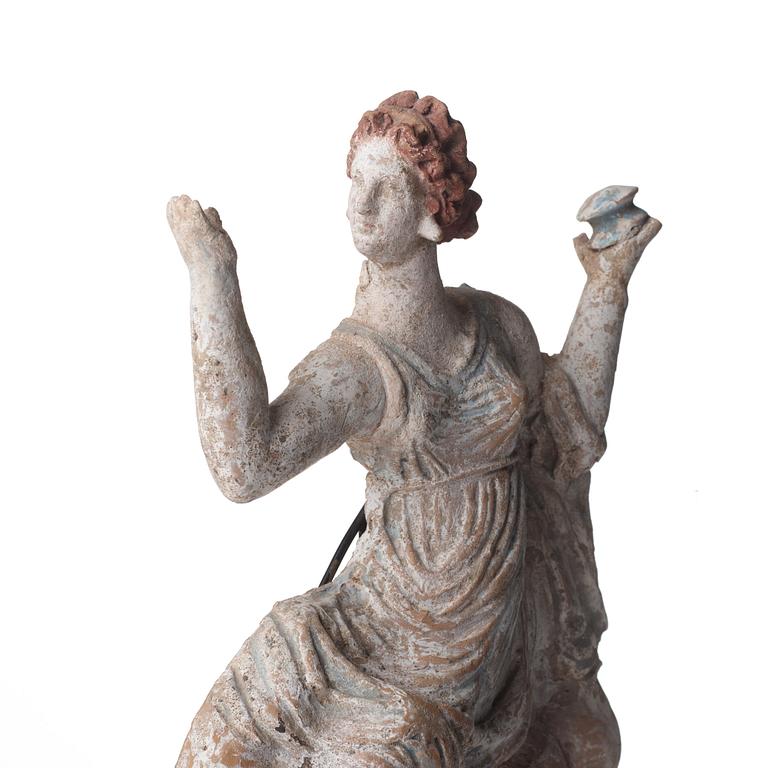 A Greek pottery sculpture of a seated lady, Hellenistic, probably circa 2nd Century B.C.