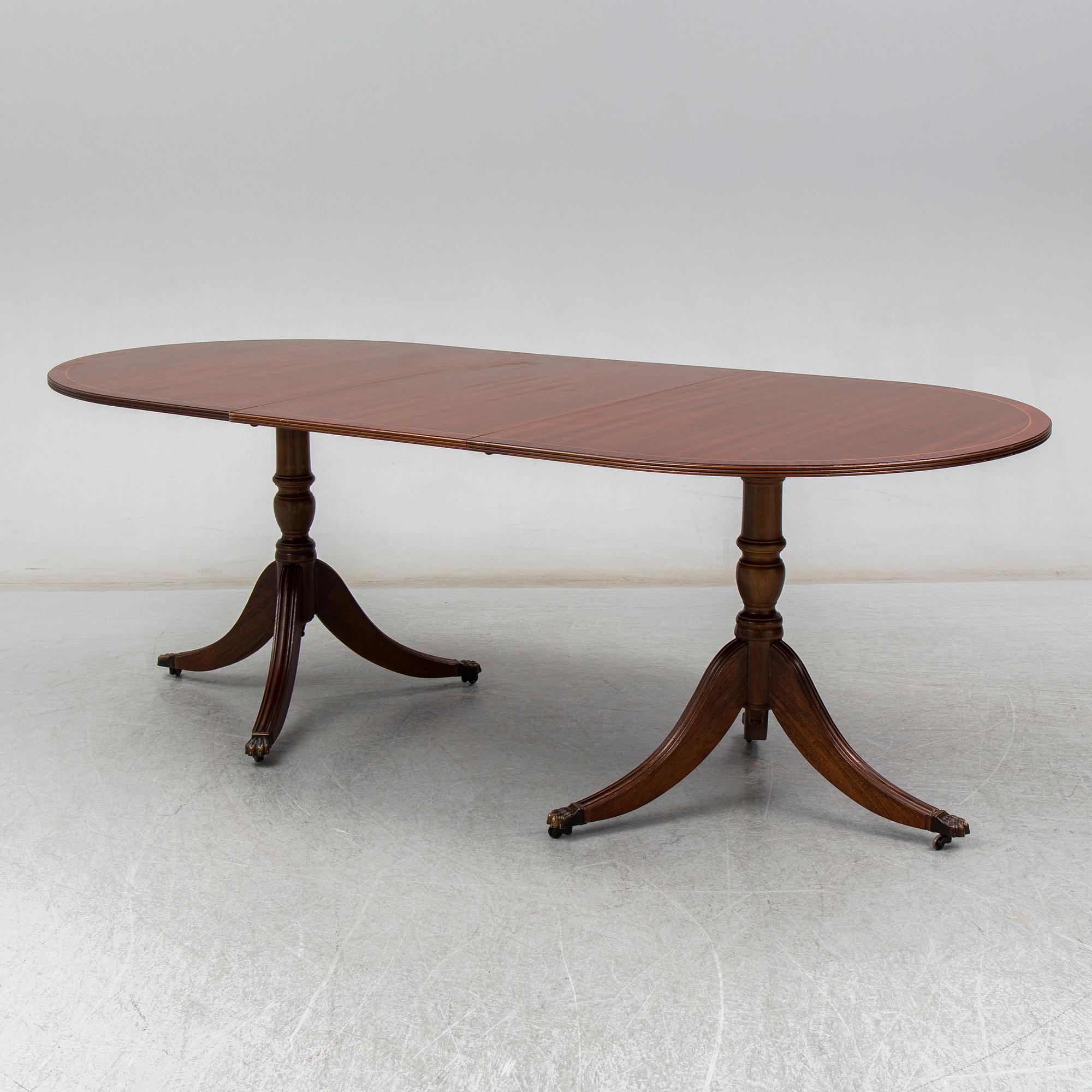 A late 20th century English dining table. One leaf included.