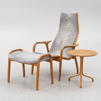 Yngve Ekström, a 'Lamino' armchair with ottoman and sidetable, Swedese, Sweden, 21st century.
