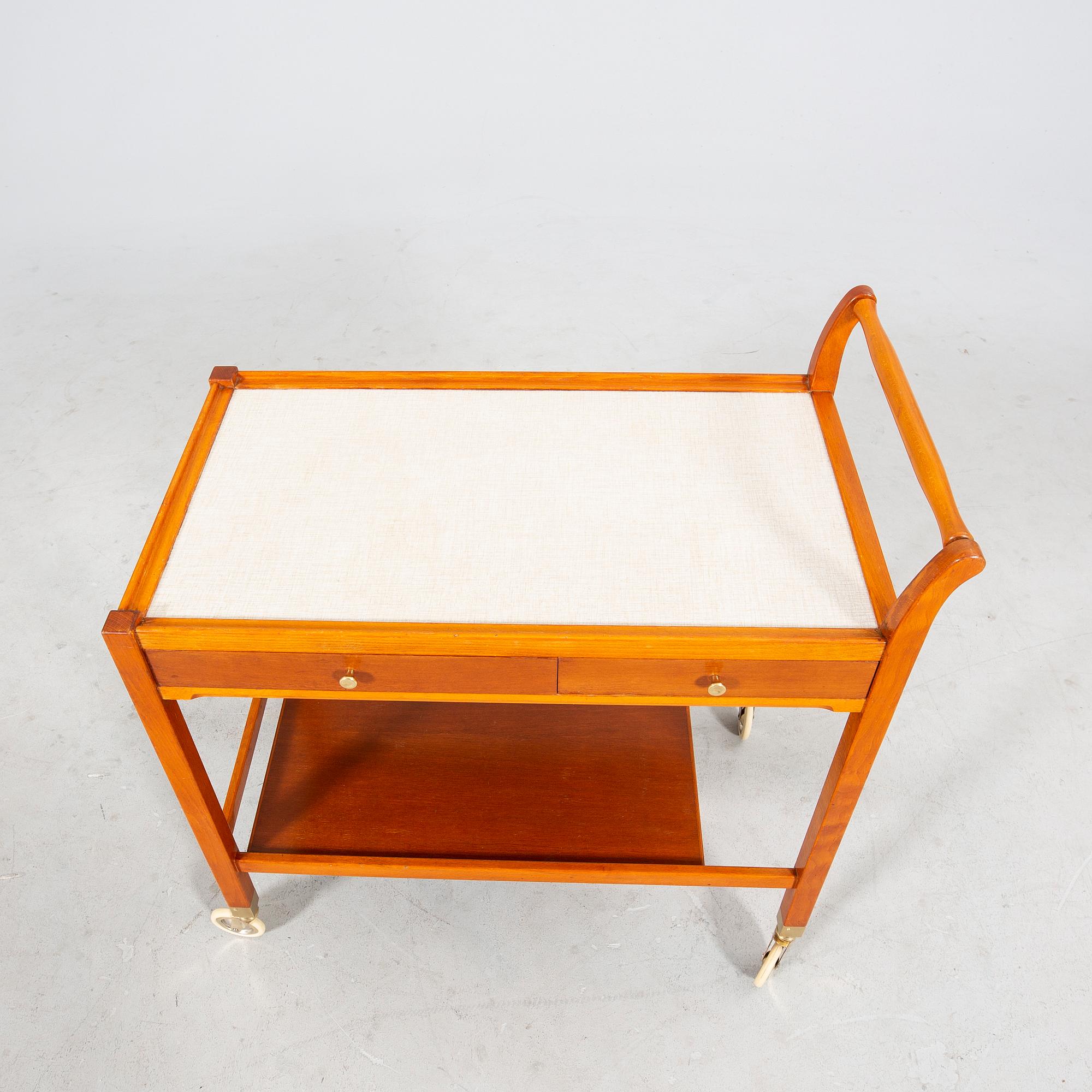 A beech and laminate 'Triva' drinks trolley from Nordiska Kompaniet 1949.