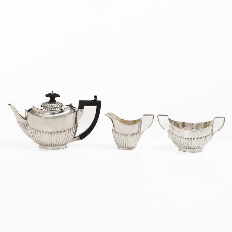 Thomas Hayes, a silver teapot, cream jug and sugar bowl, Birmingham 1897.