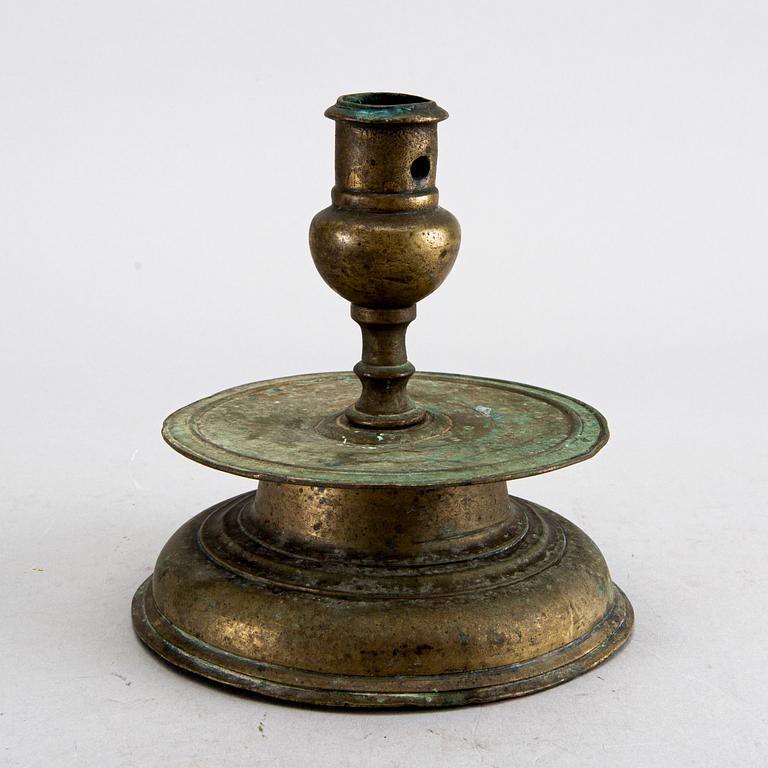 A BAROQUE BRASS CANDLESTICK, 18th century.