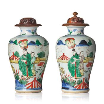 1011. A pair of wucai decorated vases, Transition, 17th century.