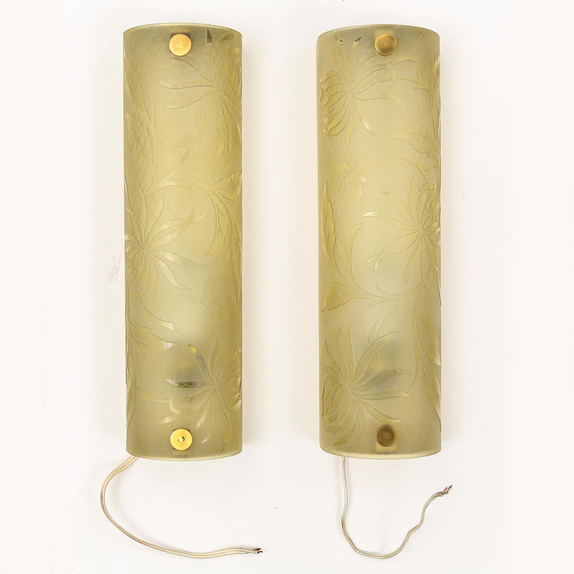 A pair of 1940s glass and metal wall lights.