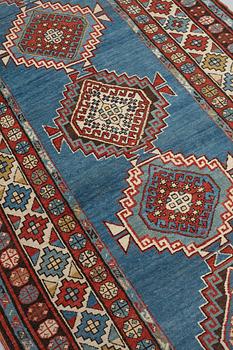 A RUNNER, a semi-antique Caucasian, ca 303,5 x 129,5-140,5 cm (as well as one end with 2,5 cm flat weave).