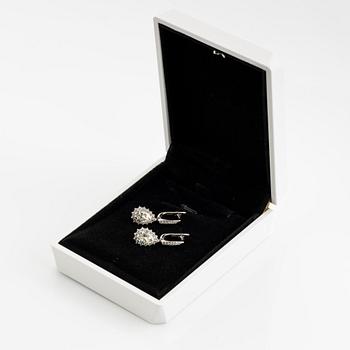 Pear shaped diamond earrings.