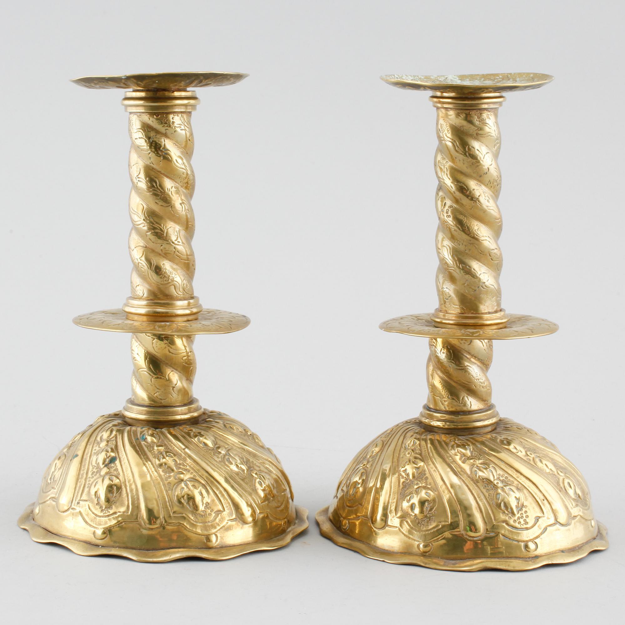 A pair of brass candlesticks, 18th century.