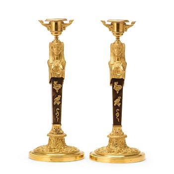 A pair of Empire circa 1810 candlesticks.