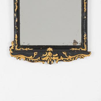 A Rococo revival mirror and a console table, second half of the 20th Century.