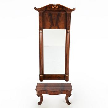A 19th Century mahogany mirror with a console table.