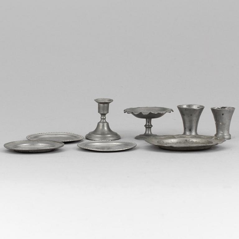 A lot of eight pewter doll house accessories 19th century.