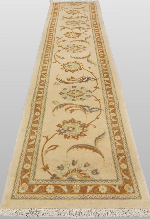 A runner carpet, Tabriz, 398 x 81 cm.